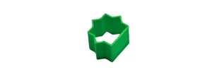 Green plastic cookie cutter with a star/flower-shaped edge, viewed from above.